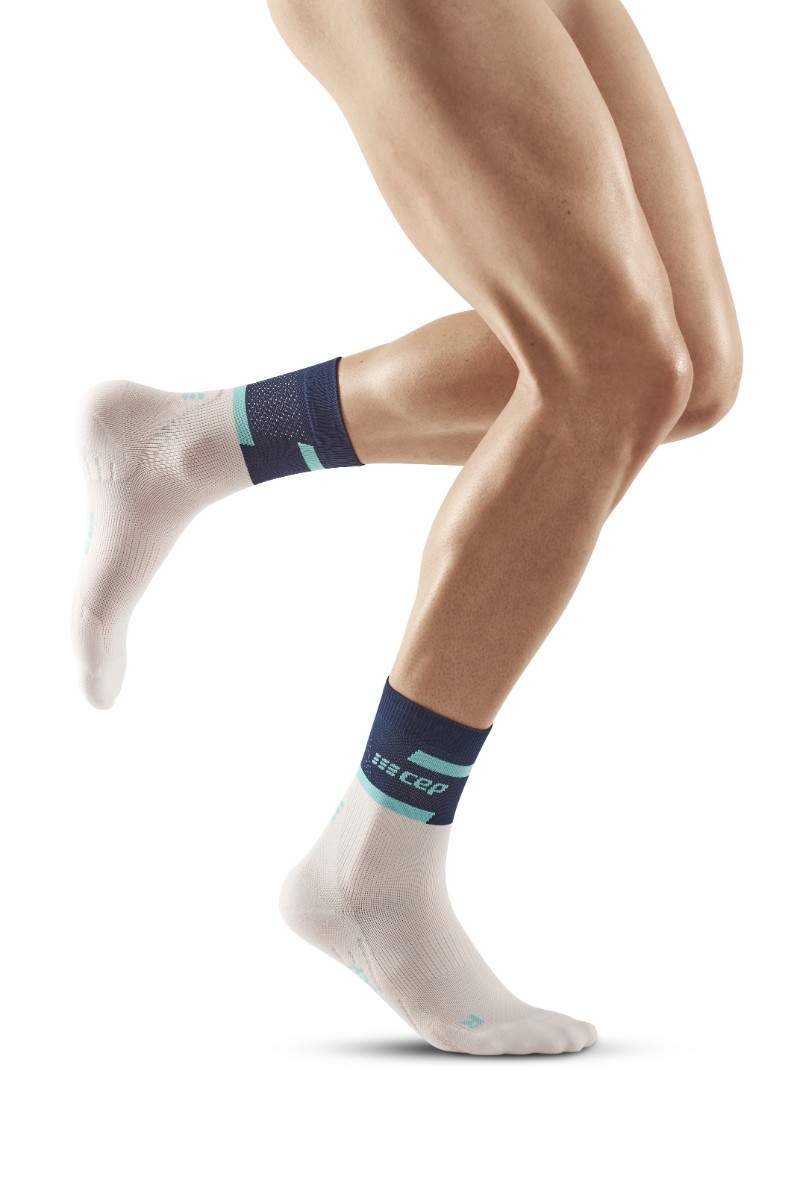 Laden Sie das Bild in Galerie -Viewer, {The Run Compressions Socks Mid Cut Men
